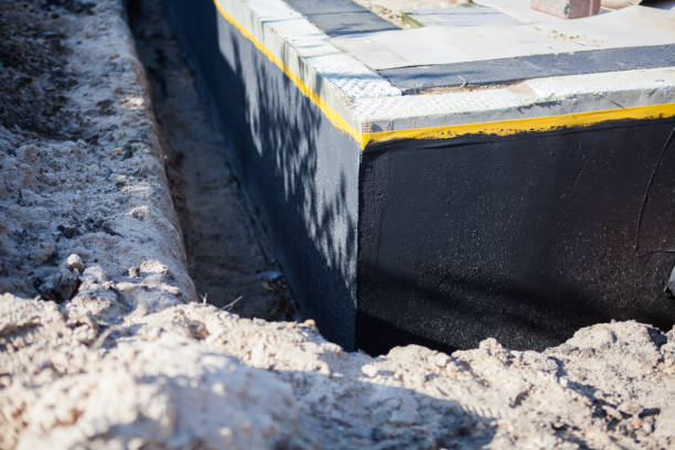 Professional Basement Waterproofing technician working in Titus, AL